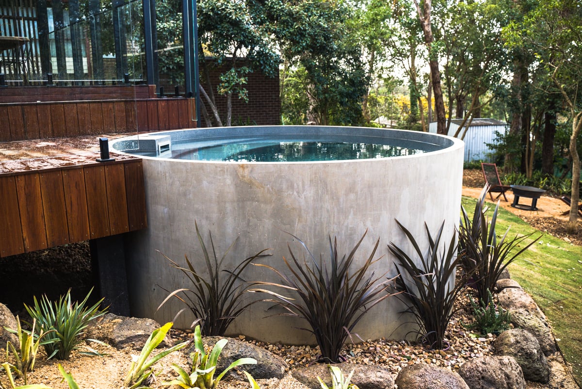 Plungie Arena 3.5m round above-ground plunge pool with concrete exterior